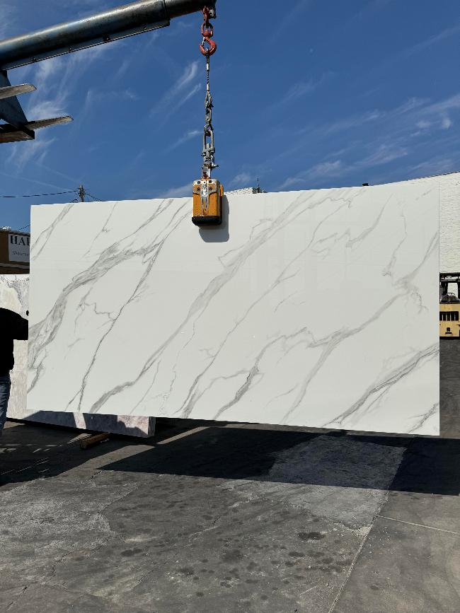Calacatta Glass slab polished white glass finish with subtle veining, in stock Los Angeles slab yard