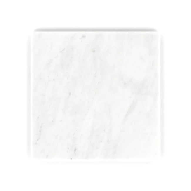 White marble tile with subtle gray veining on a white background