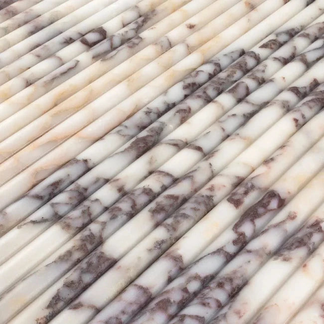 Closeup of marble fluted tile with burgundy veining