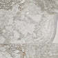 Rectangular marble tiles with a textured, stone finish in warm off-white, beige, and light gray with natural veining.