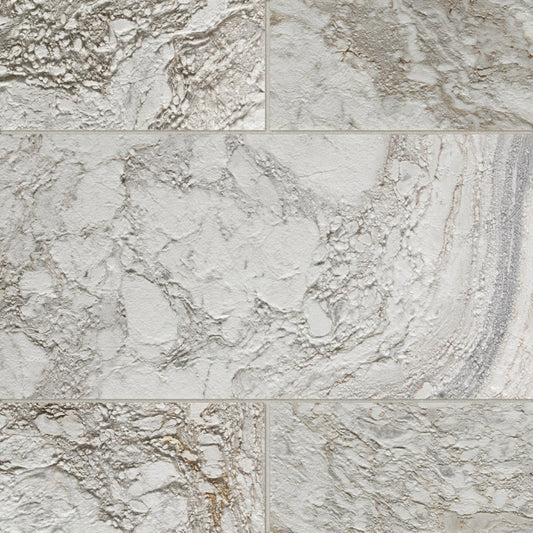 Rectangular marble tiles with a textured, stone finish in warm off-white, beige, and light gray with natural veining.