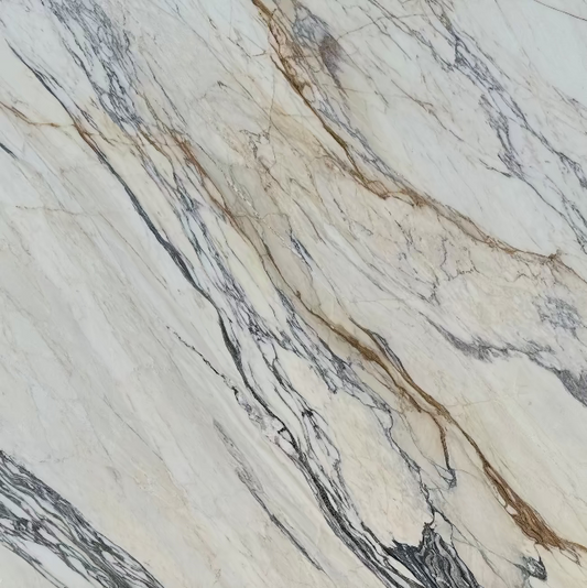 Close-up of white marble with gold and grey veining