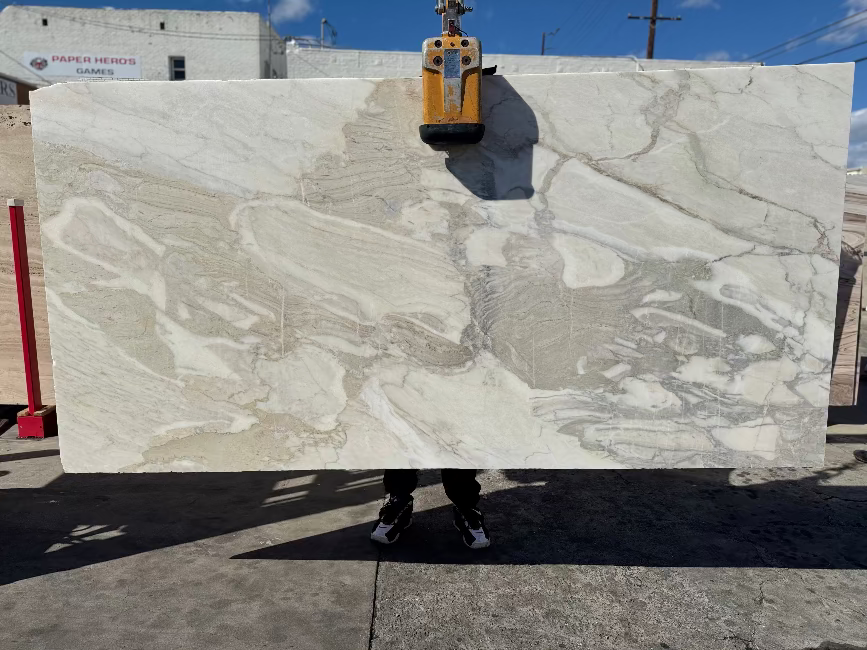 Grey marble slab with beige and gold accents in los Angeles slab yard