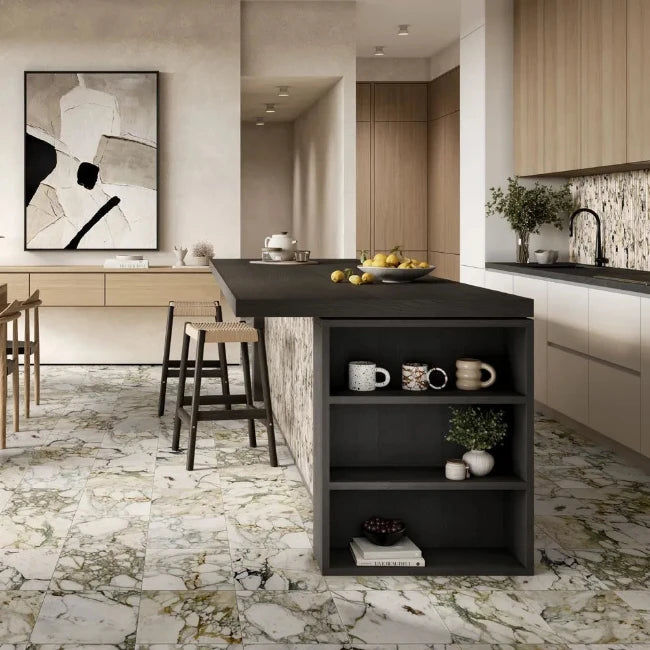 Modern kitchen with a black island and marble floor