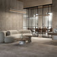 Modern interior with a beige sofa, marble floors and walls and glass walls.