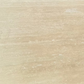 A closeup of a beige travertine stone slab.