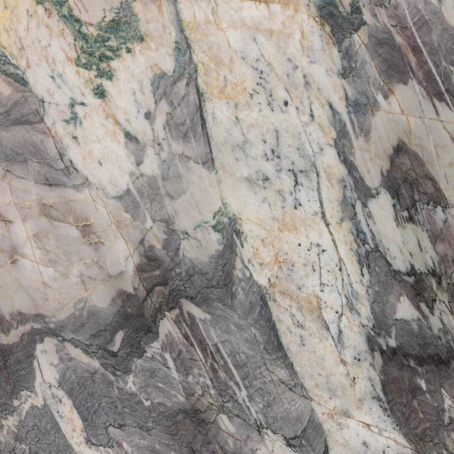 Close-up of a textured quartzite stone slab with varying shades of gray, beige, and brown.