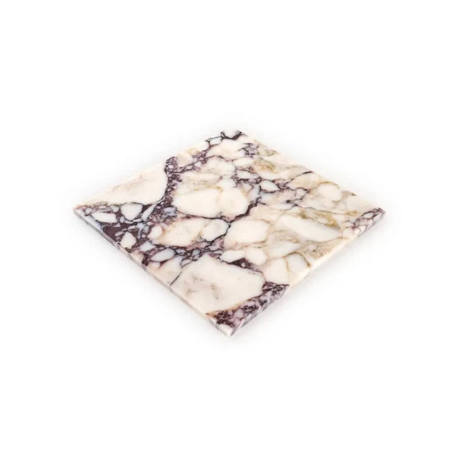 Marble-patterned square tile on a white background