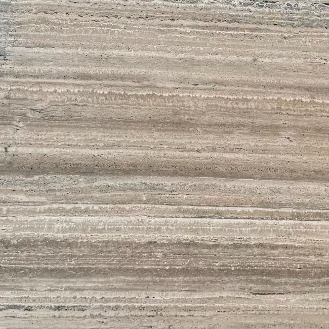 A close-up texture of a travertine stone slab surface with horizontal striations in warm beige, taupe, and light brown tones.