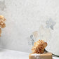 Details of white floral backsplash mosaic tile