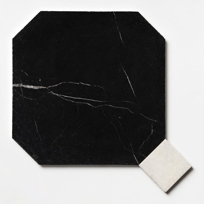 Black marble tile with a white square on a light gray background