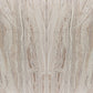 Close-up of a travertine slab with beige and brown veining