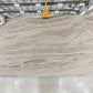 Large slab of beige travertine with veining in Los Angeles slab yard