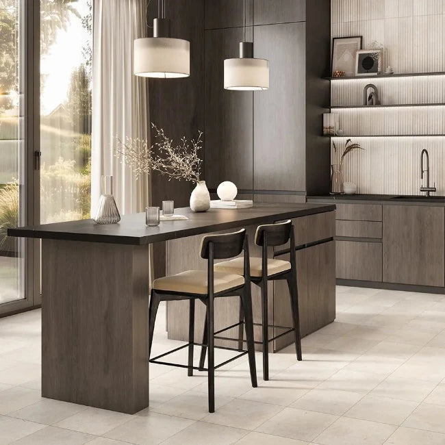 Modern kitchen with a long dark wood dining table and beige marble floor tiles.