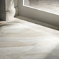 Close-up of a tiled floor with a neutral color palette