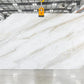 Honed Volakas Gold white dolomite slab in slab yard